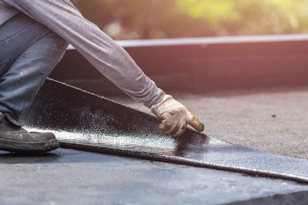 Professional Basement Waterproofing technician working in Falmouth, VA